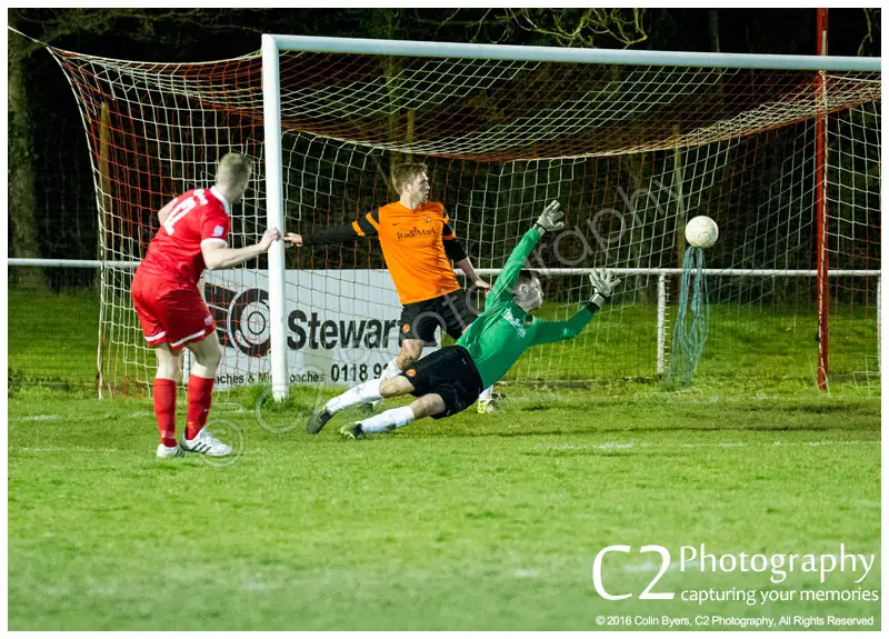 Jean-Claude Etienne scores for Binfield against Wokingham & Emmbrook in the Reading Senior Cup. Photo: Colin Byers.