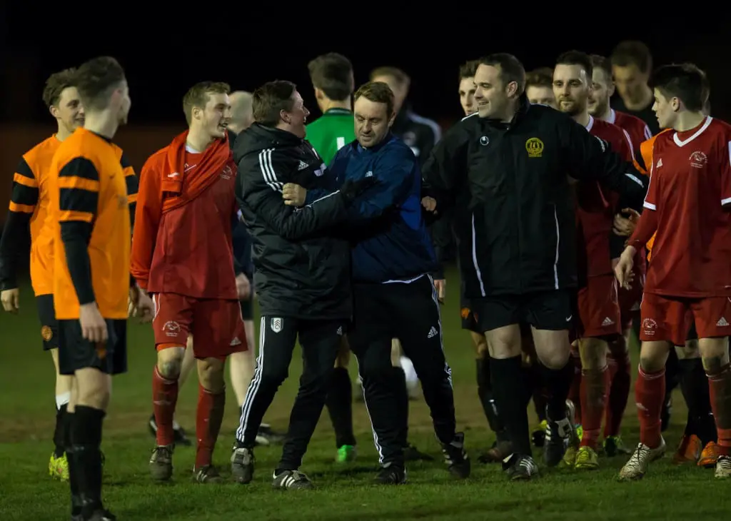 A bit of a coming together at full-time of Bracknell Town versus Wokingham & Emmbrook. Photo: Richard Claypole.