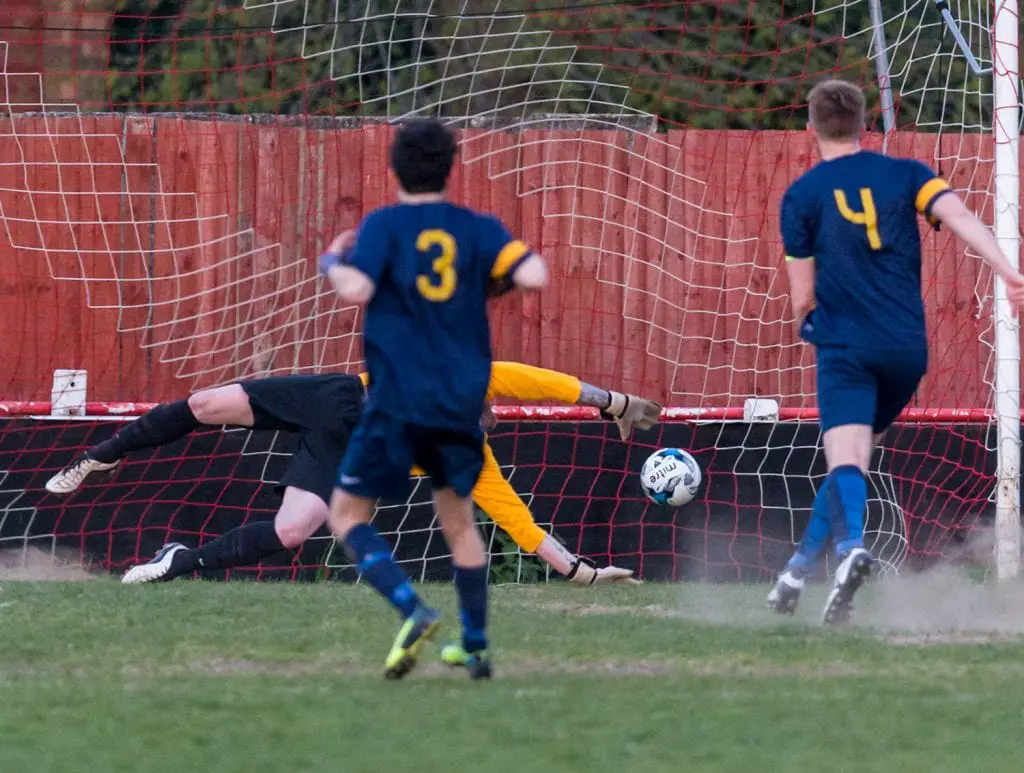 Binfield Club Athletic captain Tom Williams scores from the penalty spot in the 2015/16 League Cup final. Photo: Neil Graham.