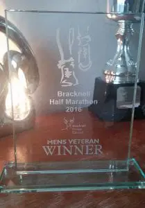 Ben Martin-Dye with his award from the Bracknell Half Marathon.