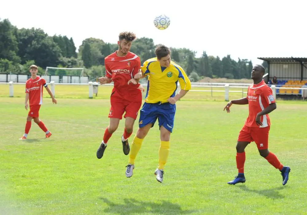 Ben Knight challenges in the air for Ascot United. Photo: Mark Pugh.