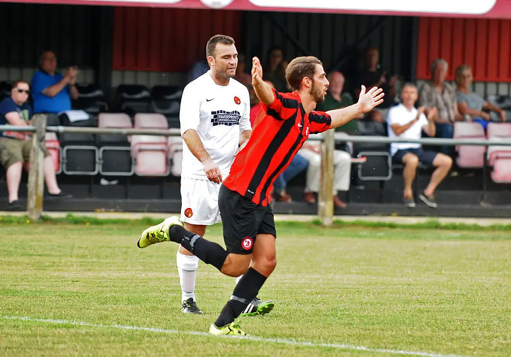 Conor Harlowe celebrates scoring for Sandhurst Town FC. Photo: Mark Pugh.