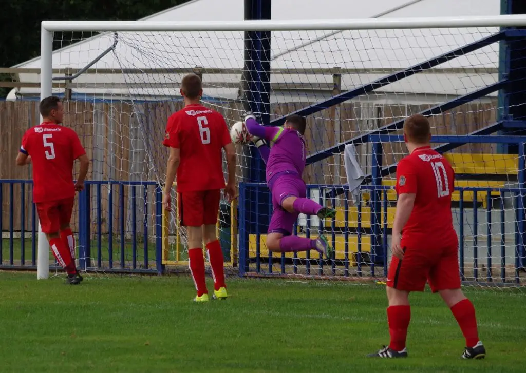Liam Vaughan makes a save for Binfield FC. Photo: James Green.