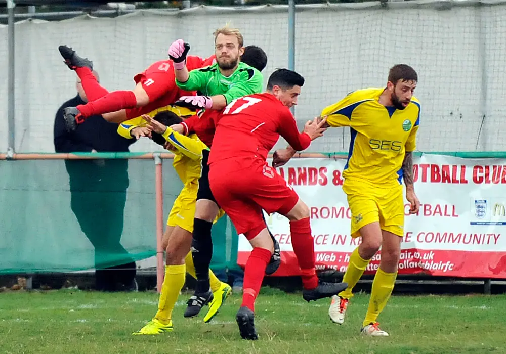Carl Dennison in the thick of it for Ascot United FC. Photo: Mark Pugh.