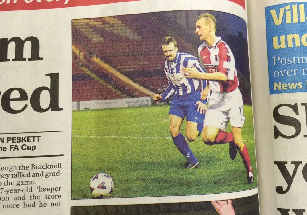 Mark Franks pictured in the Wokingham Times for Bracknell Town (blue) against Lincoln City.