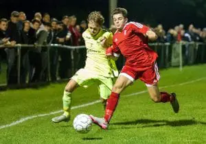 George Lock competes for the ball against Bracknell Town's Seb Bowerman. Photo: Colin Byers.