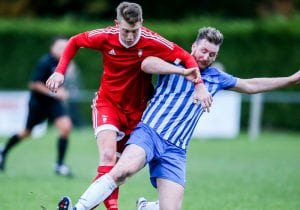 TJ Bohane takes on Thatcham Town for Bracknell Town. Photo: Neil Graham,