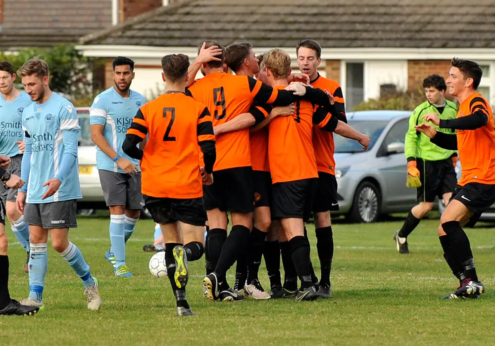 Wokingham & Emmbrook celebrate against Woodley United. Photo: Mark Pugh.