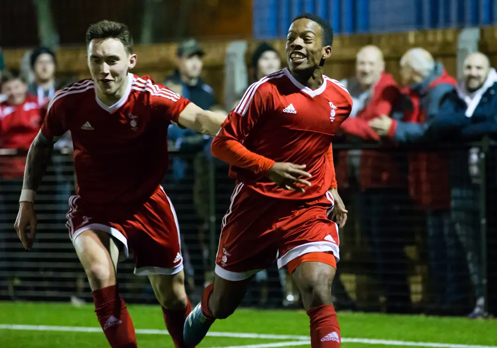 Kenlsey Maloney and Joe Grant celebrate a 90th minute winner. Photo: Richard Claypole.