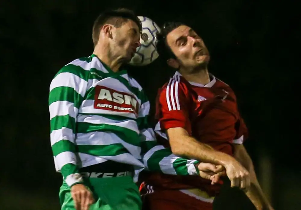 Adam Cornell challenges Thame United. Photo: Neil Graham.