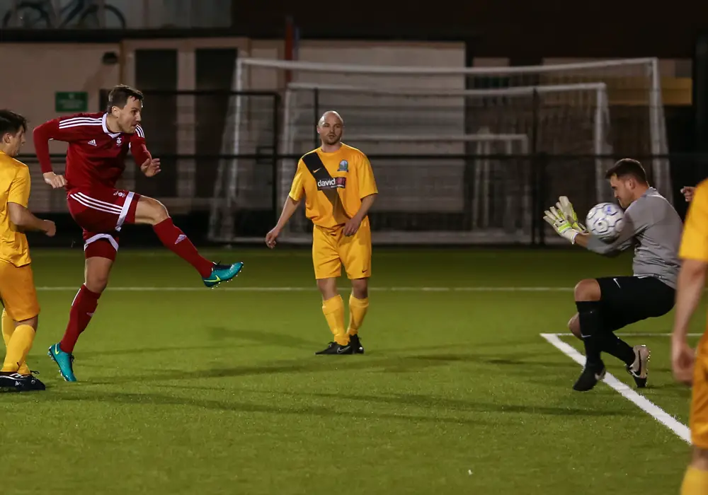 Bracknell Town FC midfielder Carl Withers fires at goal. Photo: Neil Graham.