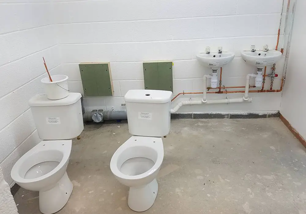 Toilets being plumbed in at Binfield FC.