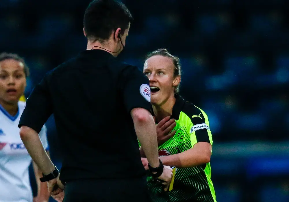 Remi Allen talks with the match referee. Photo: Neil Graham.