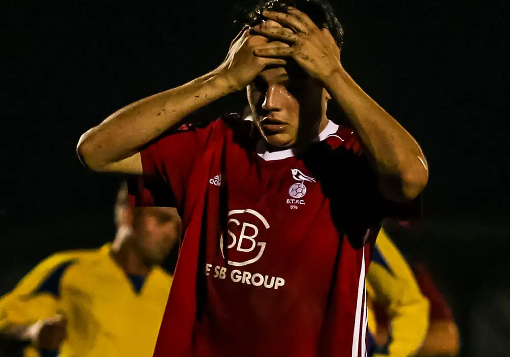 A head in hands moment for Bracknell Town's Seb Bowerman at Ascot United. Photo: Neil Graham.