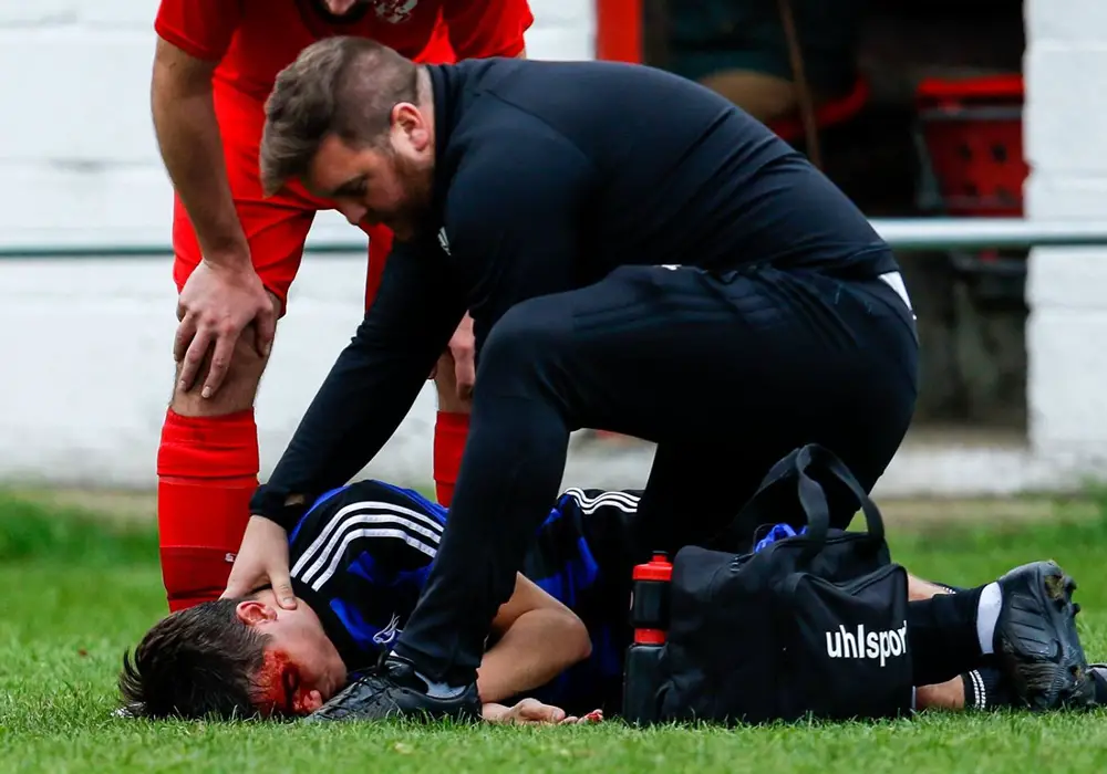 Liam Day treats Bracknell Town's Seb Bowerman. Photo: Neil Graham.