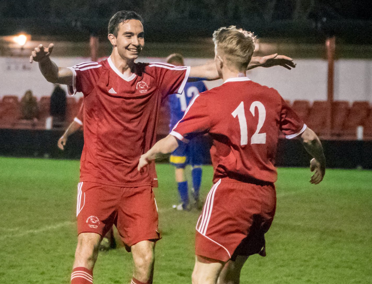Ben Poynter celebrates scoring with Sean Hanley. Photo: Neil Graham.