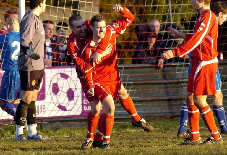 Mark Anderson scoring for Bracknell Town - mobbed by Graham Lewis. Photo: getreading.co.uk