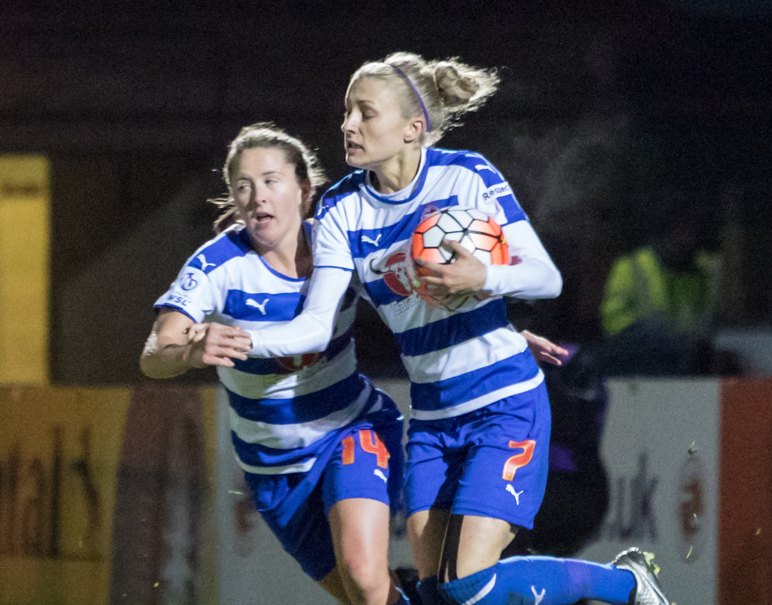 Emma Follis grabs the ball after scoring for Reading Women. Photo: Neil Graham.