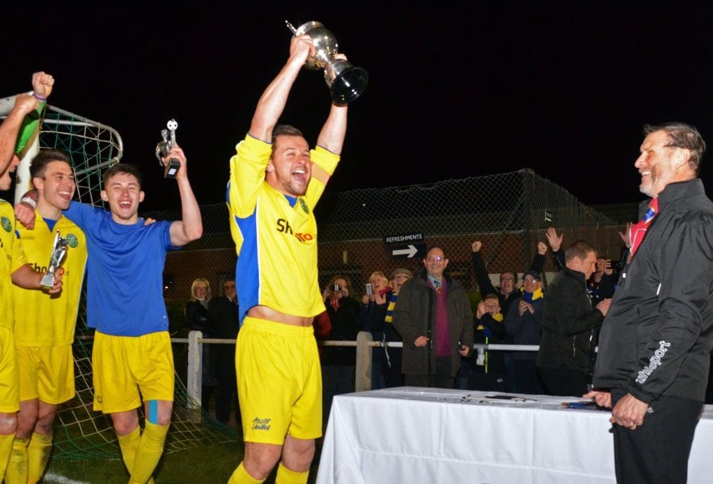 Ascot United captain Dave Hancock lifts the Floodlit Cup. Photo: Mark Pugh.