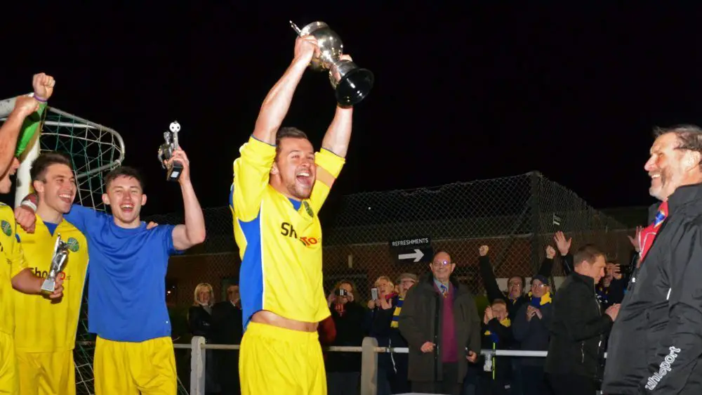 Ascot United captain Dave Hancock lifts the Floodlit Cup. Photo: Mark Pugh.