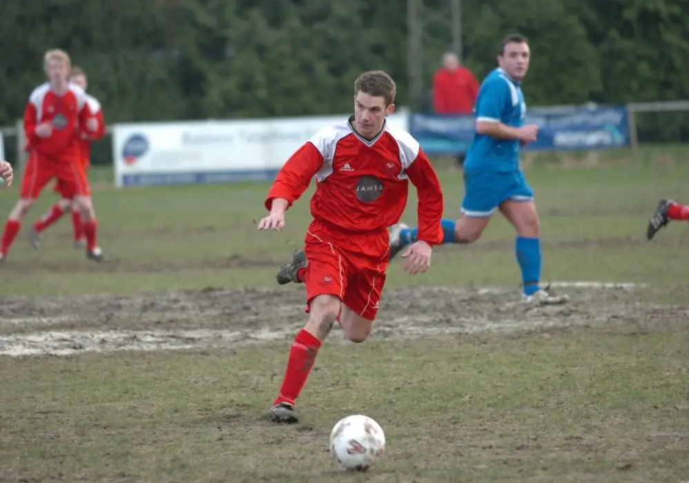 Ben Edwards plays on a muddy Larges Lane surface.