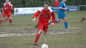 Ben Edwards plays on a muddy Larges Lane surface.