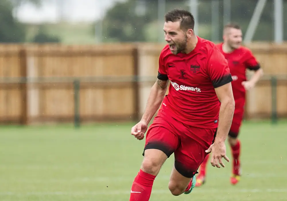 Jamie Connor celebrates scoring for Binfield FC. Photo: Colin Byers.