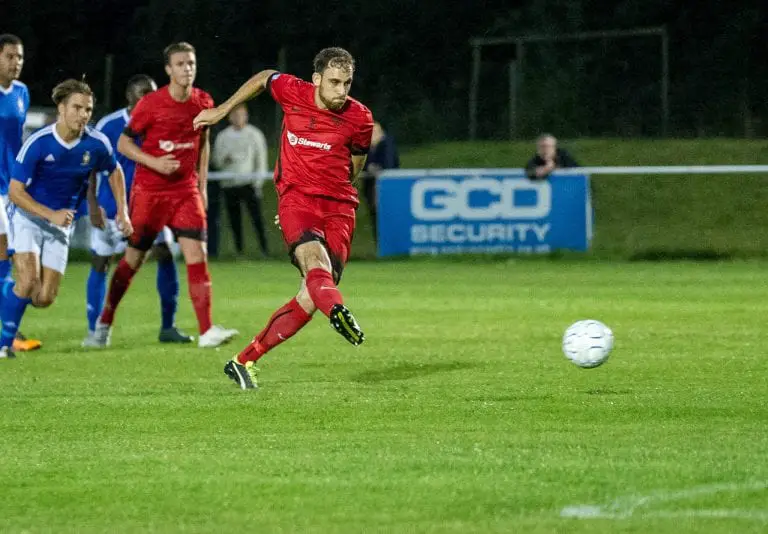 Liam Ferdinand scores a penalty for Binfield FC. Photo: Colin Byers.