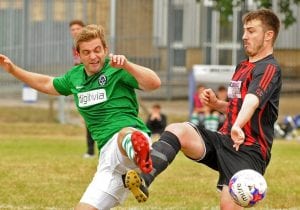 Sam Dennison challenges for Berks County FC. Photo: Mark Pugh.