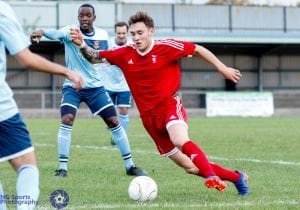 Joe Grant in full flow for Bracknell Town FC. Photo: Neil Graham.