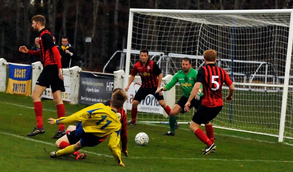 James Goodey gets a shot away for Ascot United FC. Photo: Mark Pugh.