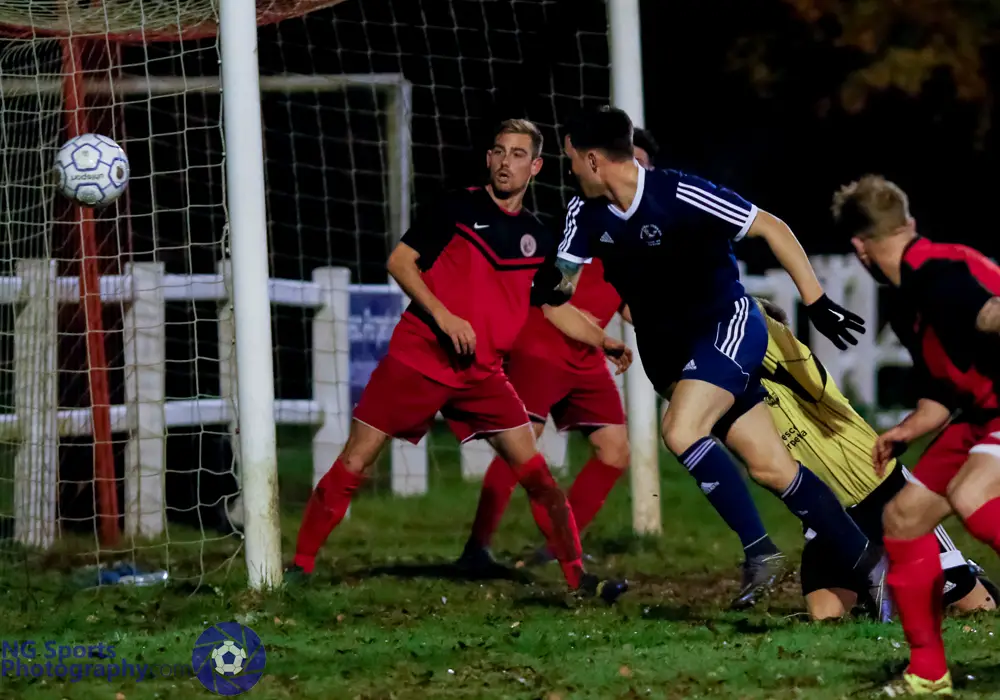 Joe Grant scores a header for Bracknell Town FC. Photo: Neil Graham.