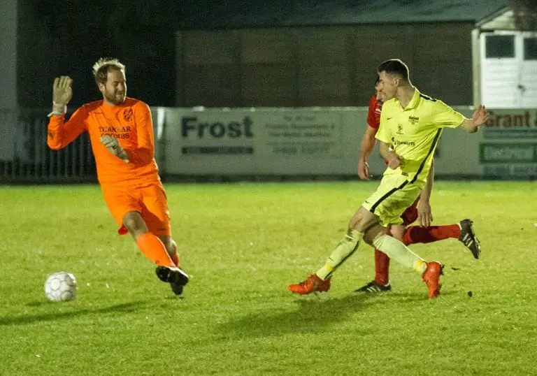 Luke Hayden scores for Binfield FC against Flackwell Heath. Photo: Colin Byers.