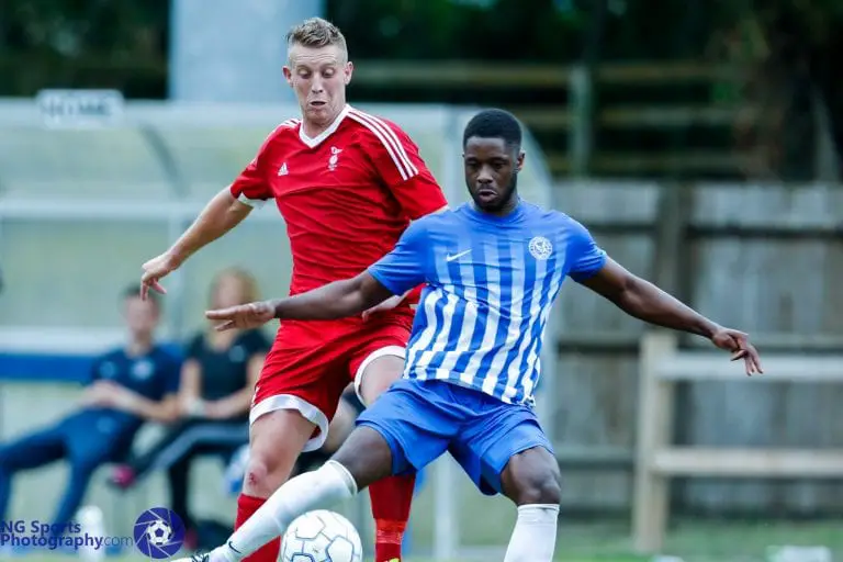 TJ Bohane takes on Thatcham Town for Bracknell Town. Photo: Neil Graham.