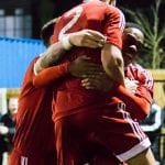 Kensley Maloney is mobbed by his Bracknell Town FC team mates. Photo: Richard Claypole.