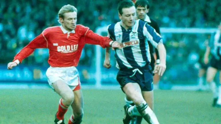 Mark Franks playing for Woking against West Bromwich Albion. Photo via @cardinal_tales