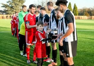 Teams shake hands before Bracknell Town FC vs Lydney Town AFC. Photo: Neil Graham.