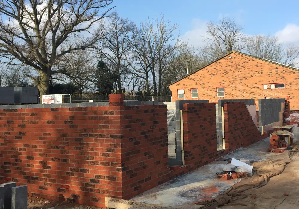 Walls going up at Hill Farm Lane around the new changing room block. Photo: Bob Bacon.
