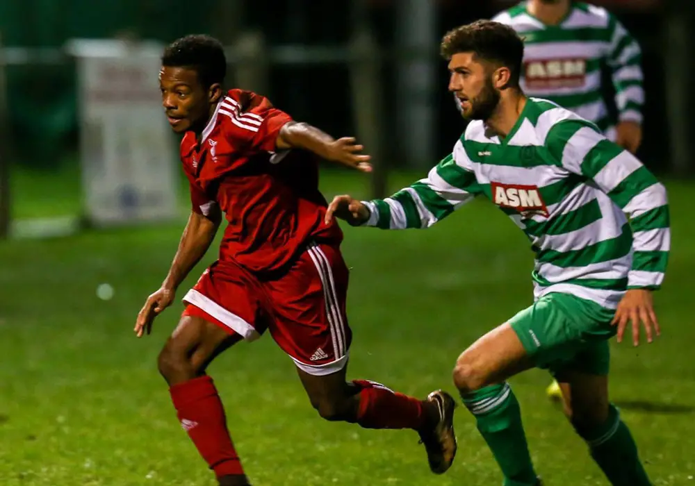 Sprint to the finish. Kensley Maloney against Thame United. Photo: Neil Graham.