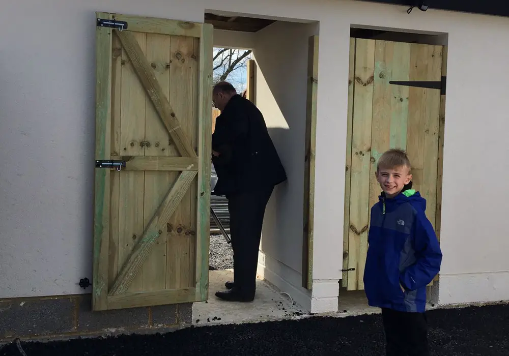 Bracknell Town FC fan Luca Calvert-Brydges prepares to use the new Larges Lane turnstile. Photo: Nick Calvert.