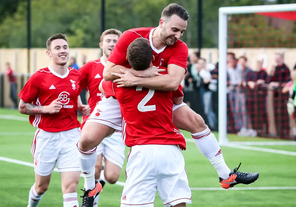 Adam Cornell celebrates scoring for Bracknell Town. Photo: Neil Graham.
