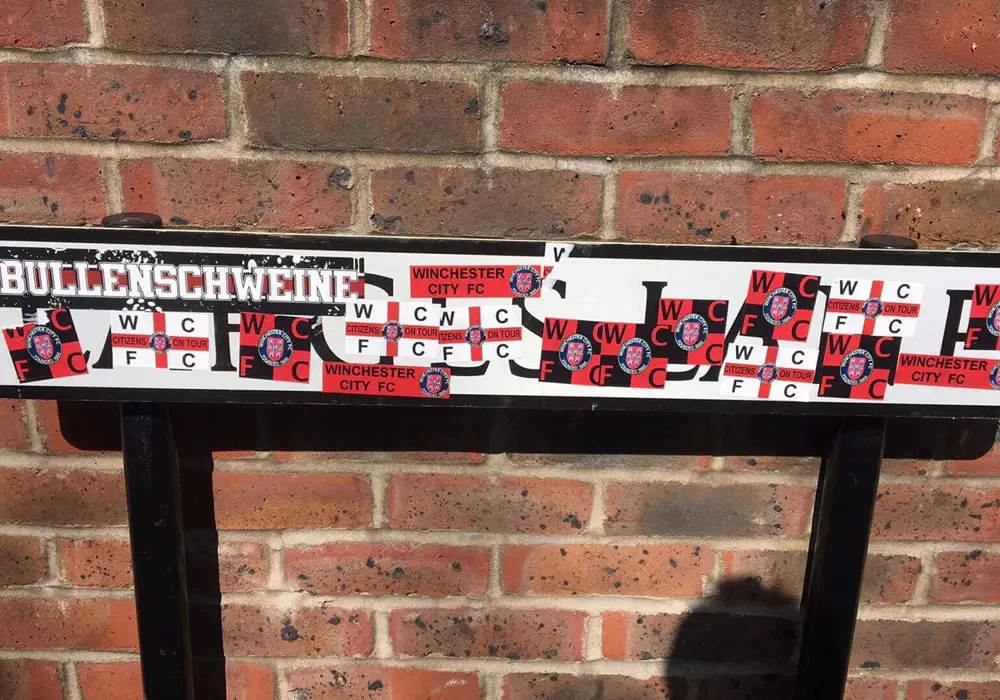 The Larges Lane road sign stickered by Winchester City fans. Photo: bracknelltownfc