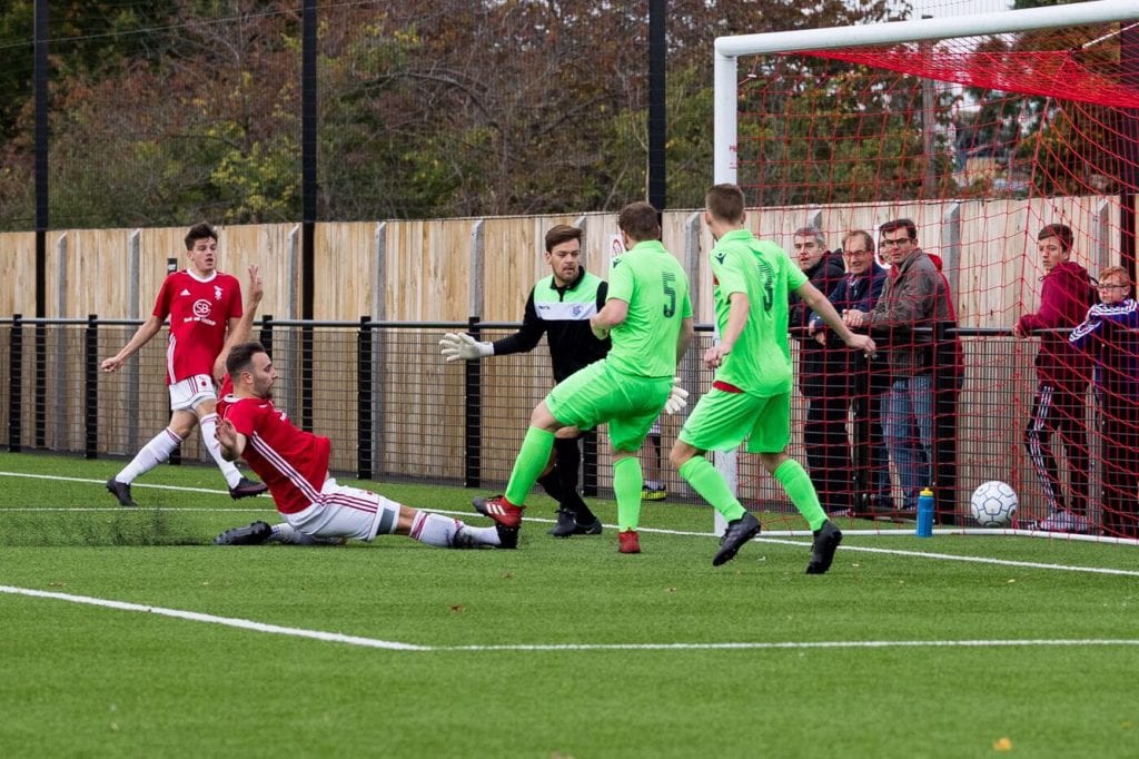 Adam Cornell scores for Bracknell Town against Oxford City Nomads. Photo: Richard Claypole.