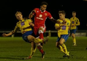 A defensive challenge for Ascot United against MK Dons. Photo: Neil Graham.