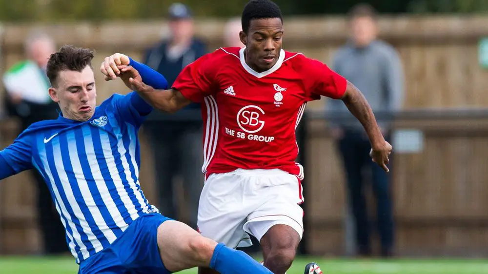 Bracknell Town's Kensley Maloney takes on Thatcham Town. Photo: Richard Claypole.