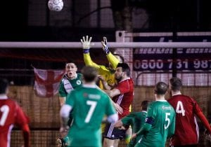 Chris Grace claims the ball against Blackfield & Langley. Photo: Neil Graham.