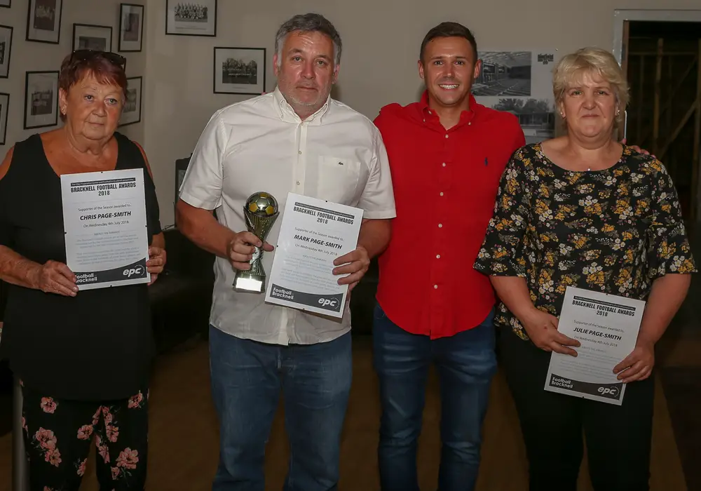 Mark, Chris and Julie Page-Smith accept their award for Supporters of the Season. Photo: Neil Graham