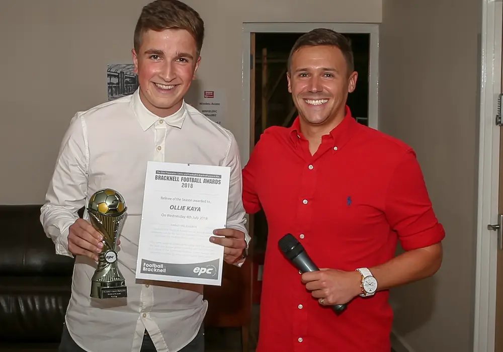 Ollie Kaya accepts his award for referee of the season. Photo: Neil Graham