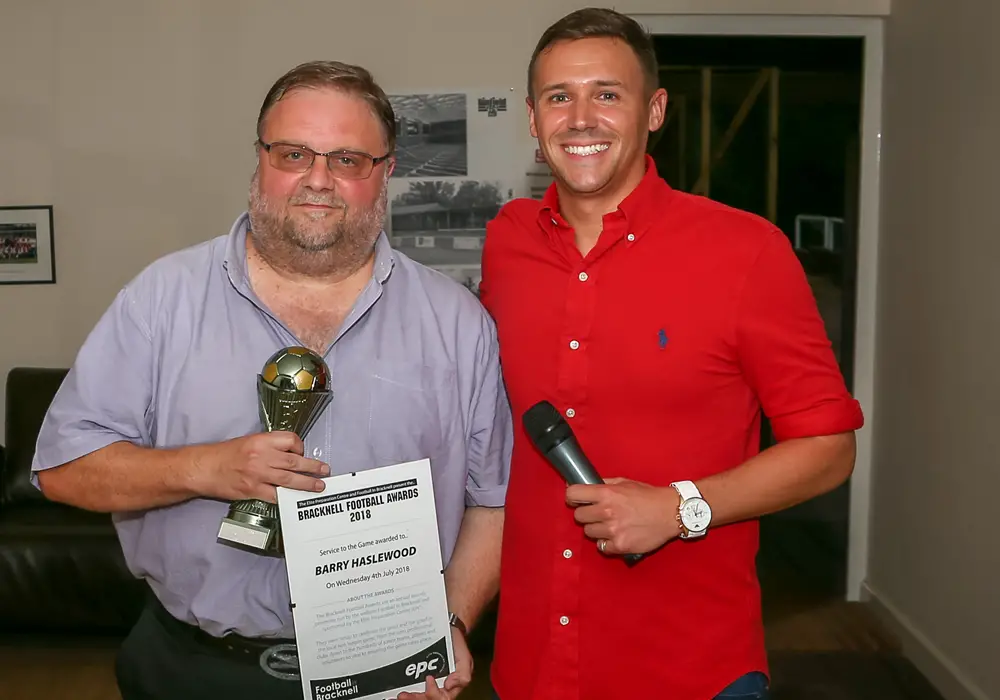 Glyn Wellington accepts the Service to the Game Award on behalf of Barry Haslewood. Photo: Neil Graham