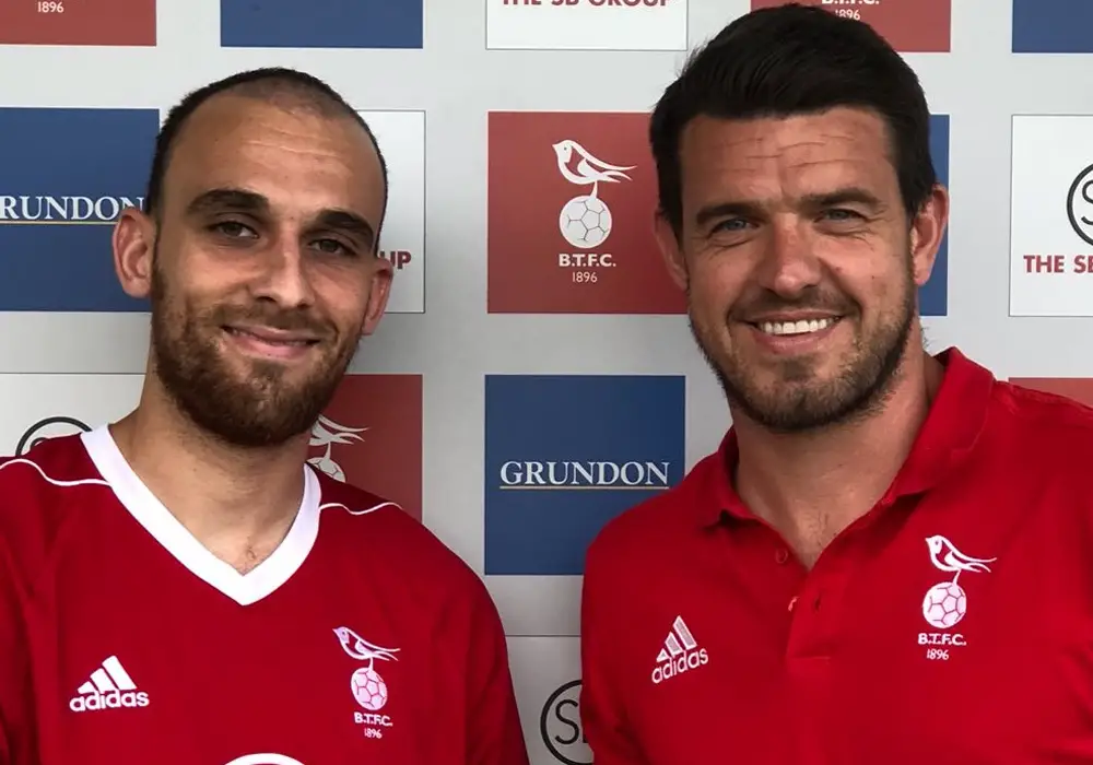 Liam Ferdinand (left with Carl Davies) re-signs for Bracknell Town. Photo: Bracknell Town FC